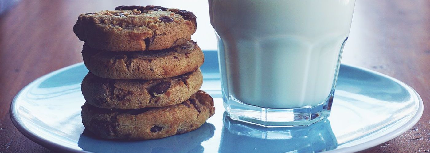choc chip cookies with a glass of milk